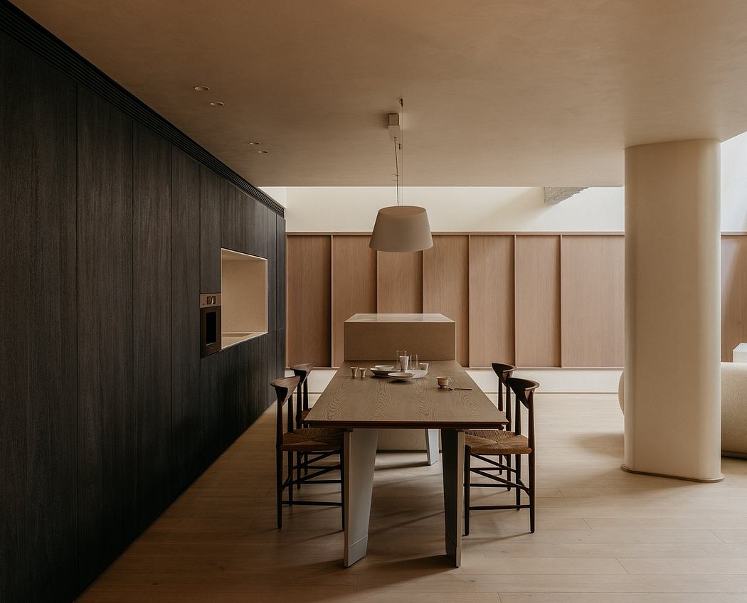 A striking modern dining room with dark wood paneling, a large wooden table, and minimalist decor.
