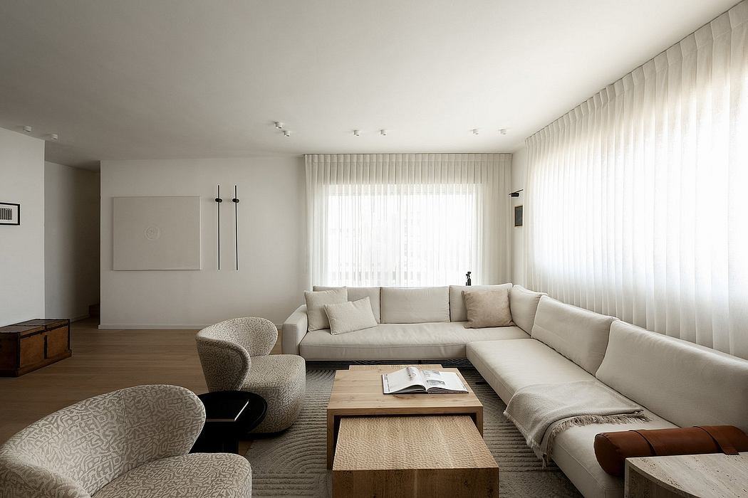 Minimalist living room with sectional sofa, low wooden coffee table, and textured decor.
