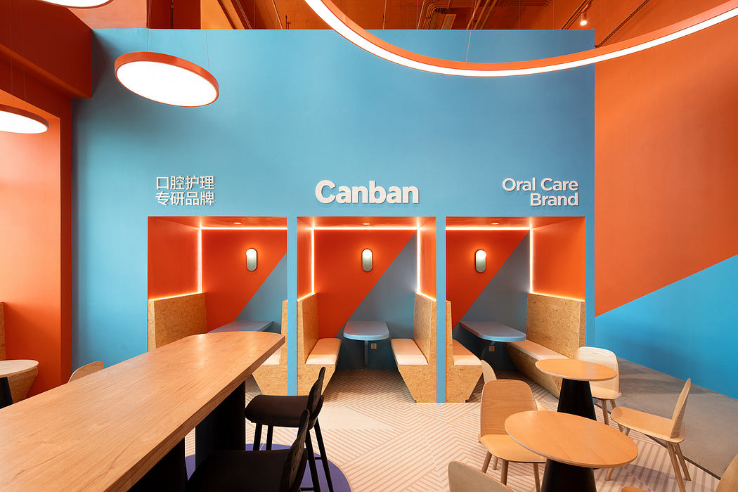 Vibrant, modern interior design with distinct orange and teal accents, geometric forms, and eclectic seating.