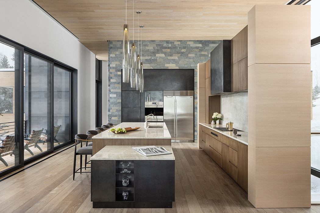 Sleek, contemporary kitchen with stone accent wall, wood paneling, and modern pendant lights.