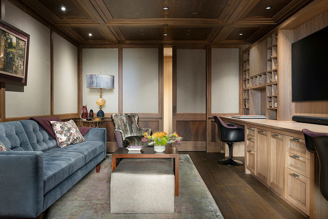 Cozy living room with wooden paneled walls, built-in shelves, and modern furniture.