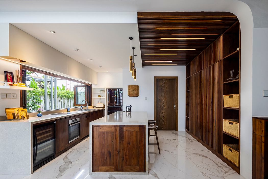 Elegant modern kitchen with warm wooden accents, marble flooring, and clean lines.