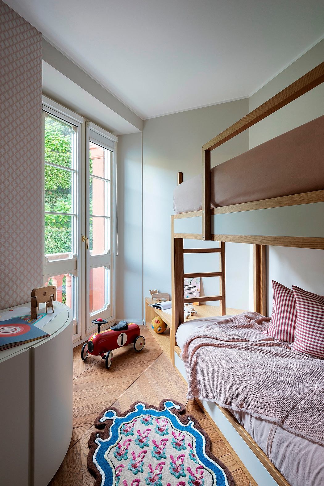 Cozy child's bedroom with bunk bed, bright colors, and playful decor elements.