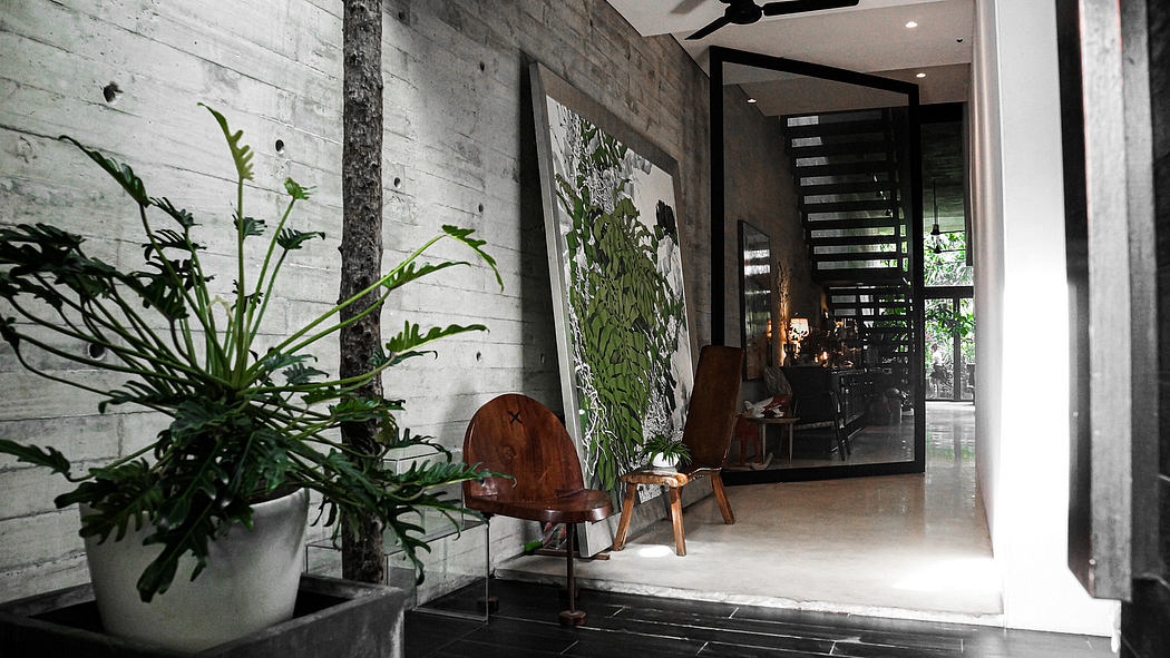 A modern, industrial-style interior with concrete walls, potted plants, and wooden furniture.