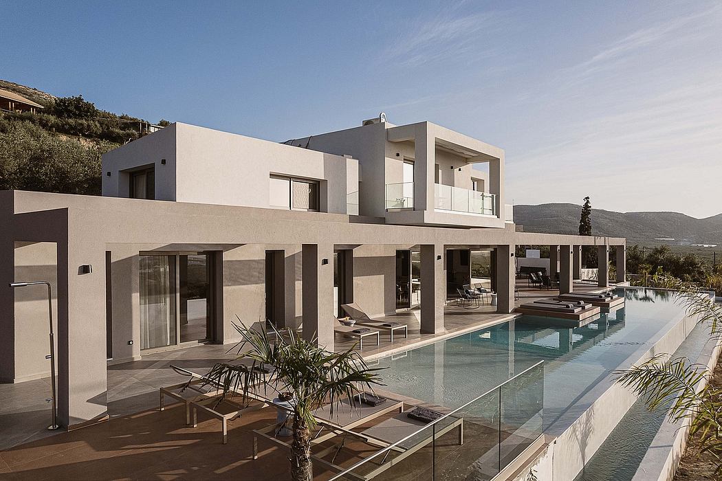 Striking modern villa with sleek architecture, expansive pool, and lush landscaping.