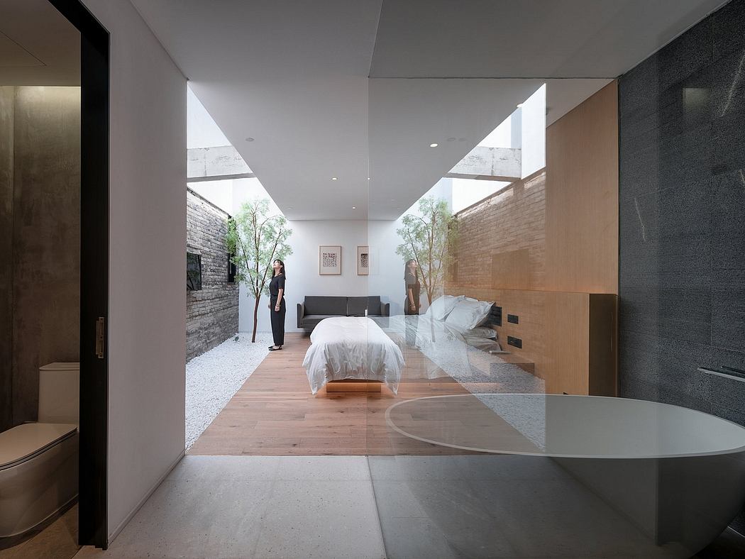 Spacious, modern bedroom with natural light, minimalist design, and seamless indoor-outdoor flow.