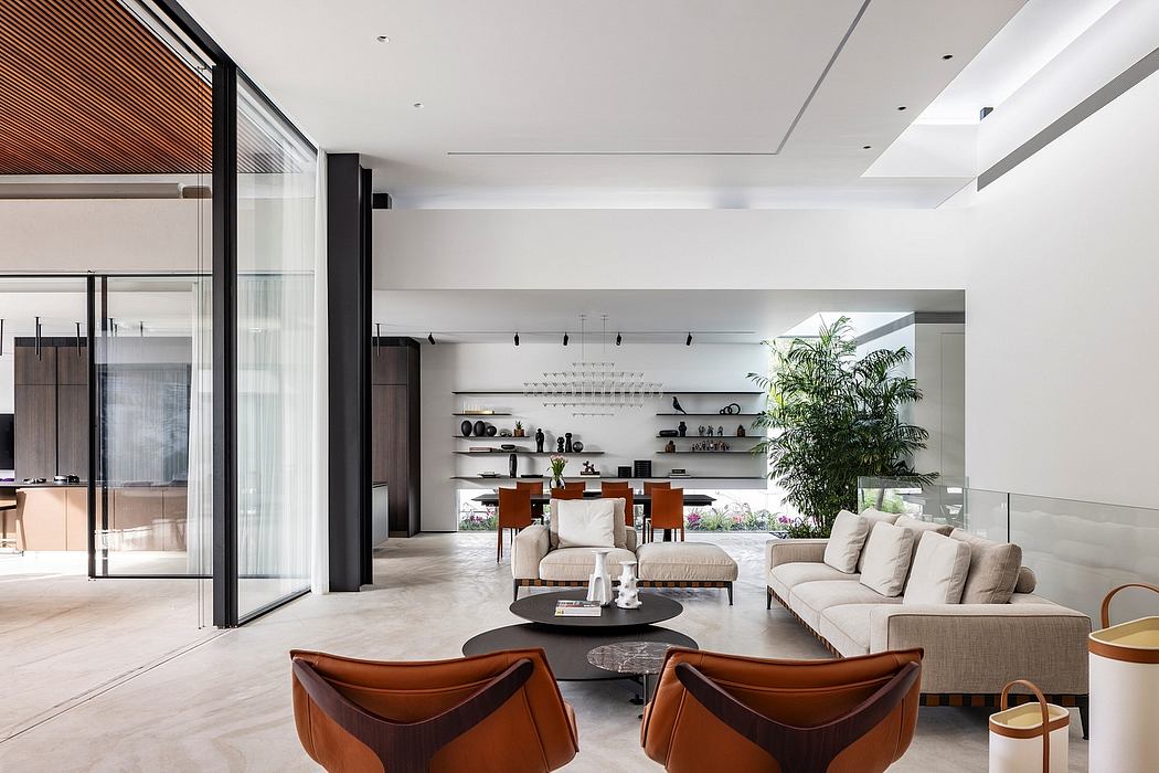 Spacious, minimalist living room with wooden and glass elements, built-in shelves.