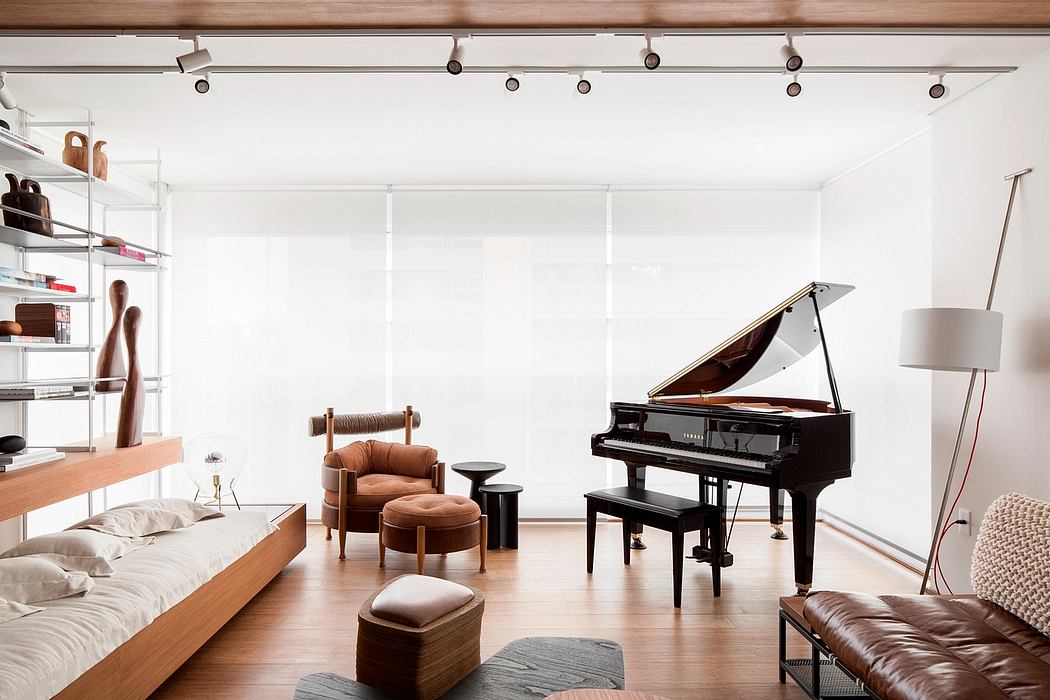 Minimalist modern living space with grand piano, leather furniture, and wooden shelving.