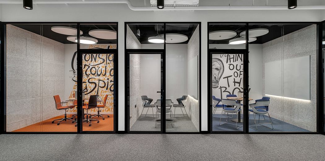 Modern office with bold graffiti walls, glass partitions, and ergonomic furniture.