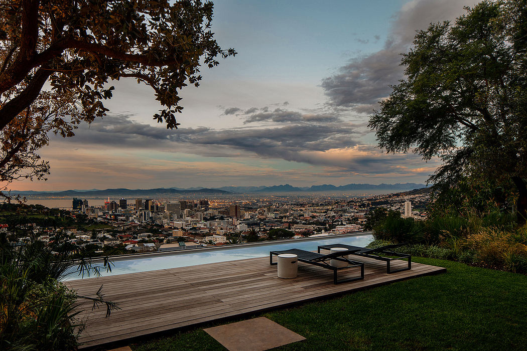 Stunning city skyline view with modern wooden deck, infinity pool, and outdoor furniture.