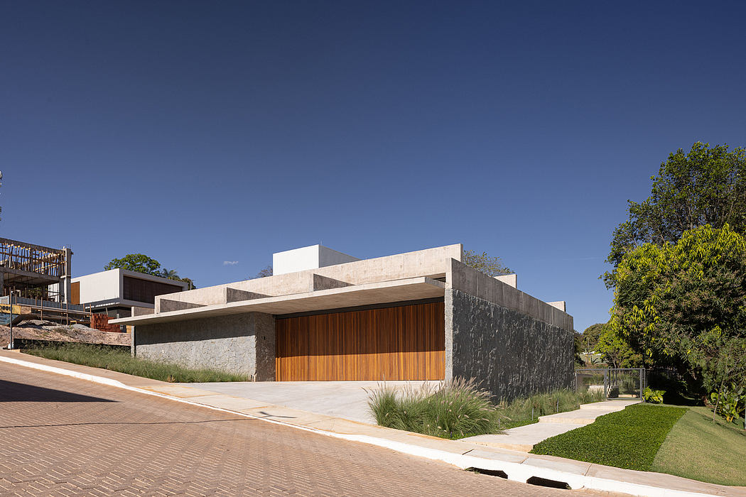 A modern, minimalist building with striking contrasting materials and geometric forms.