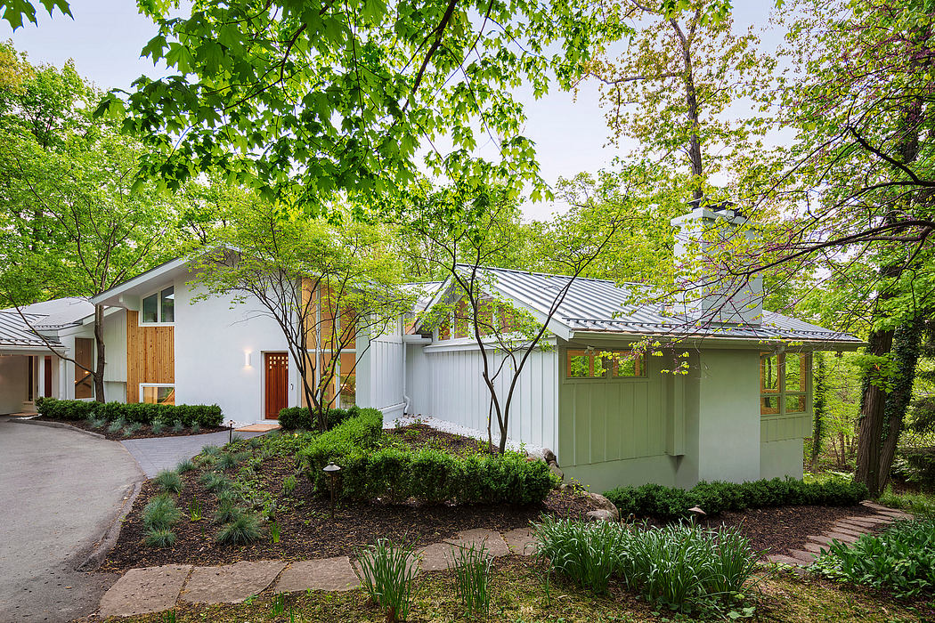 Serene mid-century modern home surrounded by lush greenery and wooden accents.