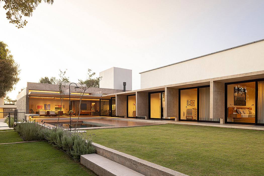 A modern, open-plan house with a lush, well-manicured lawn and a vibrant, inviting aesthetic.