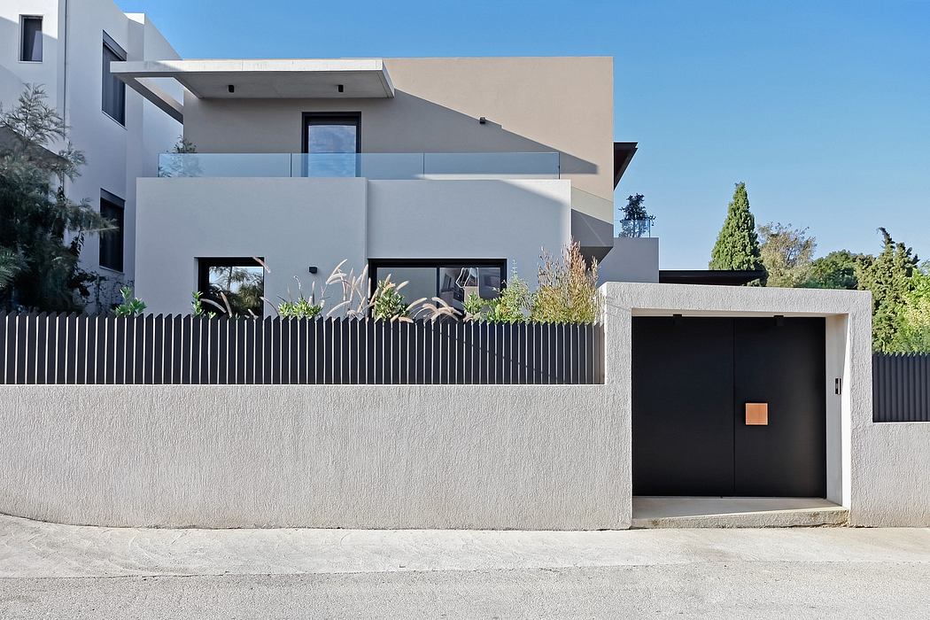 Modern architectural design with clean lines, neutral colors, and integrated landscaping elements.