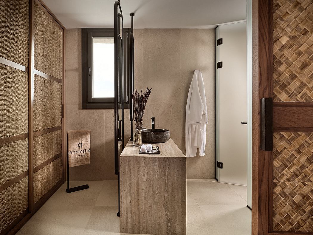 A minimalistic, earthy bathroom design with natural stone and textured surfaces.