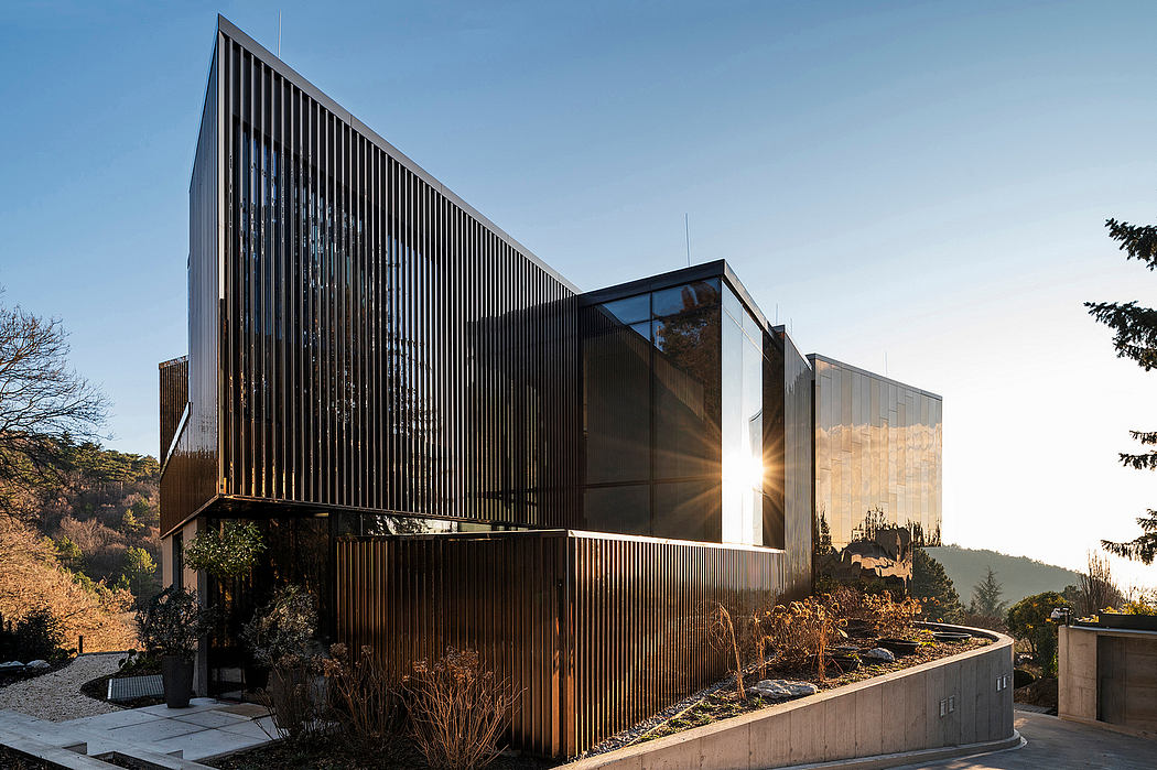Striking modern architecture with angled facade and extensive glass windows.