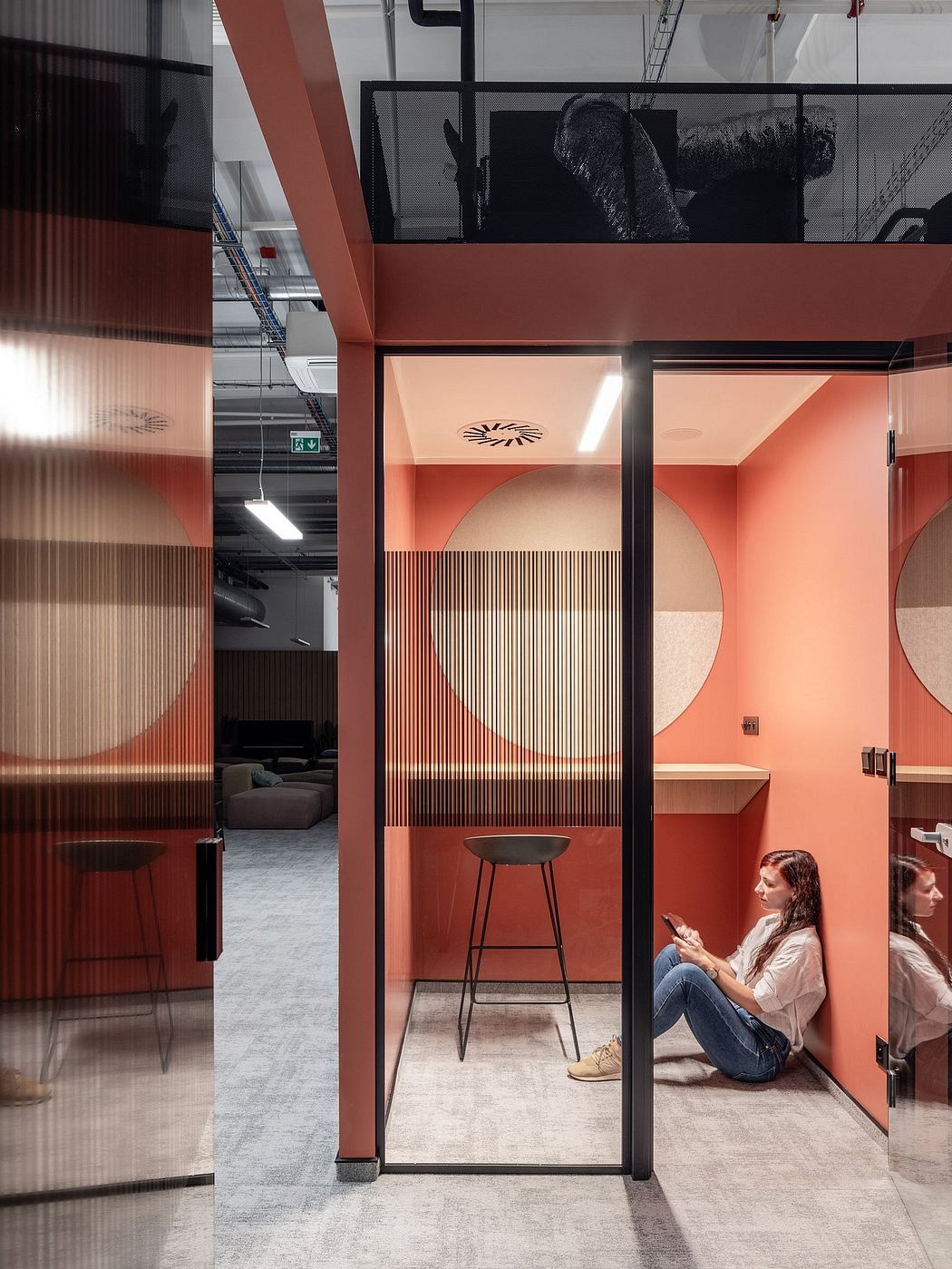 Modern office space with minimalist decor, vibrant color palette, and architectural elements.