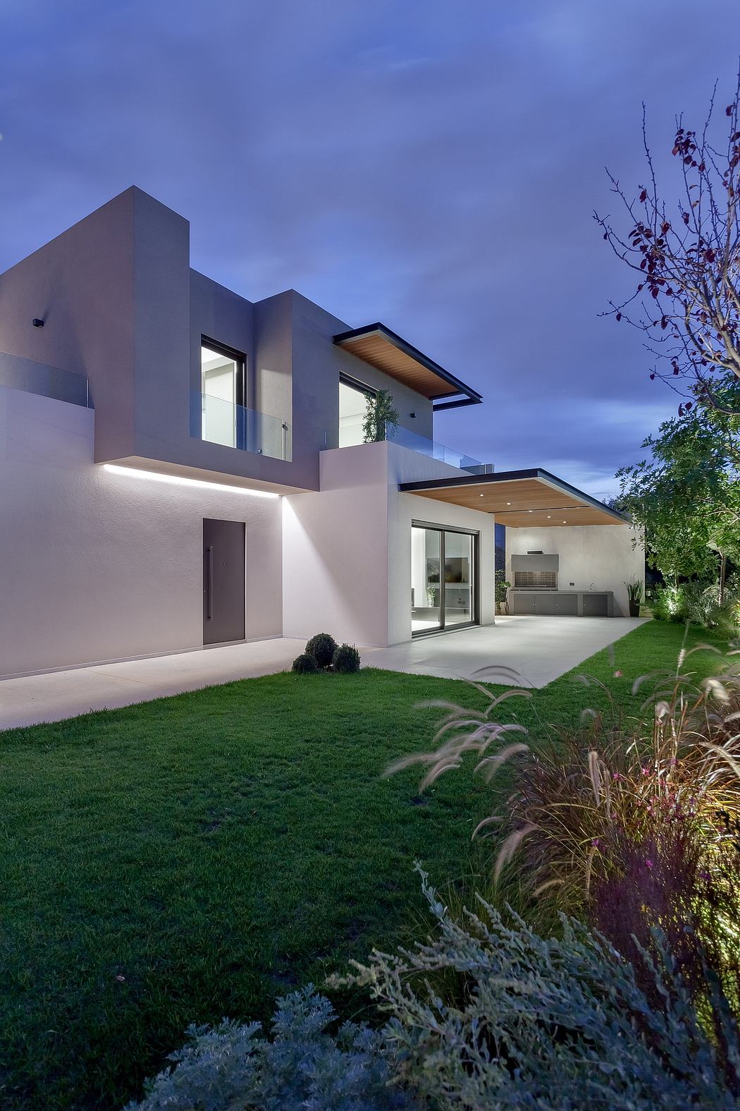A modern, multilevel home with clean lines, large windows, and architectural details.