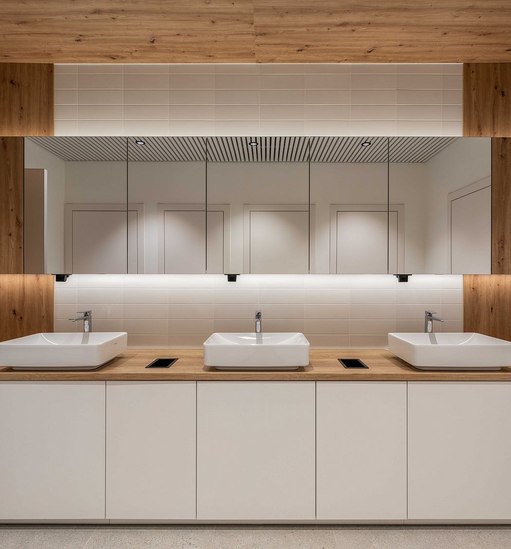 A modern bathroom design with minimalist cabinetry, vessel sinks, and a striking wooden accent wall.