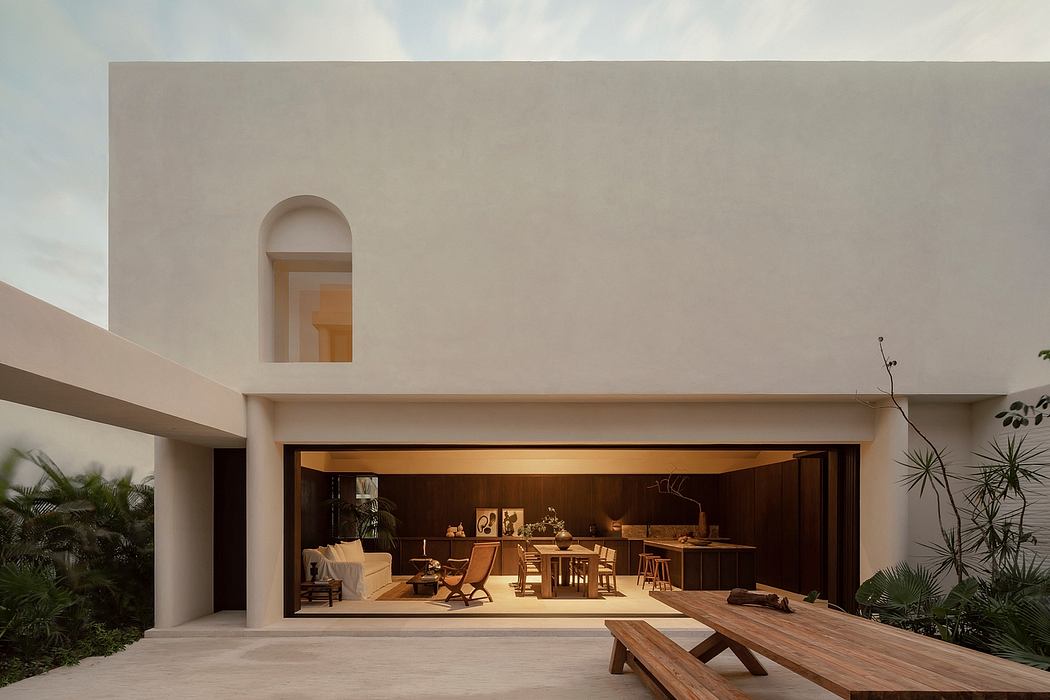 Warm-toned, modern architectural structure with an open, inviting indoor-outdoor design.