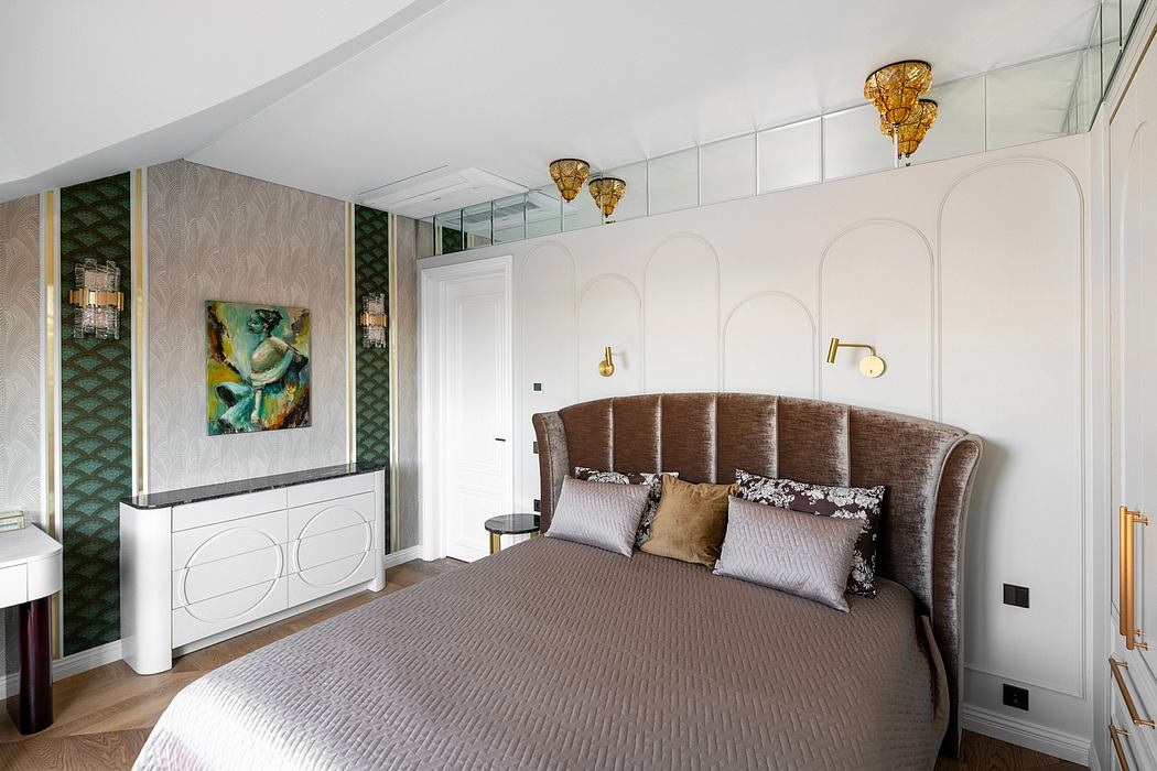 Luxurious bedroom with curved headboard, gold accents, and bold artwork.