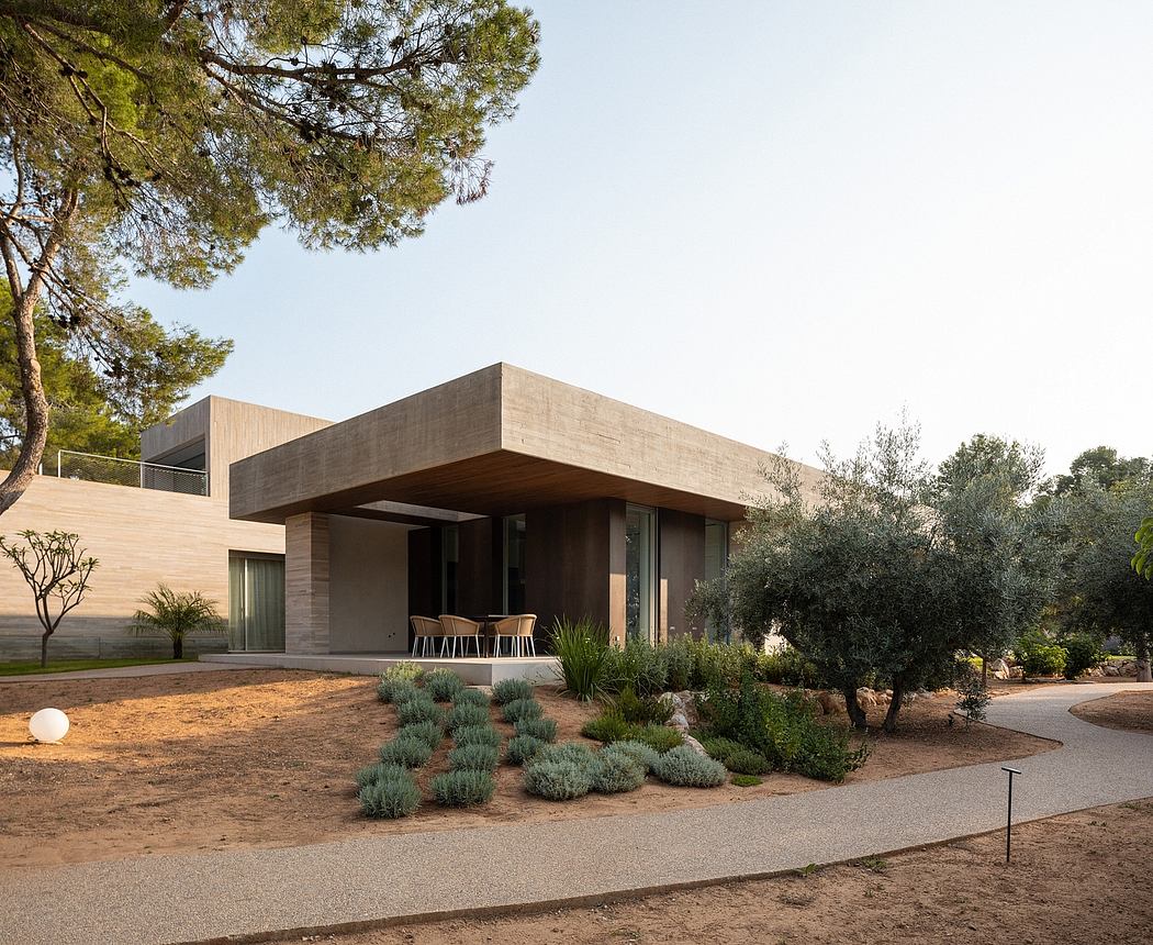 Modern, minimalist house with clean lines, large overhanging roof, and natural landscaping.