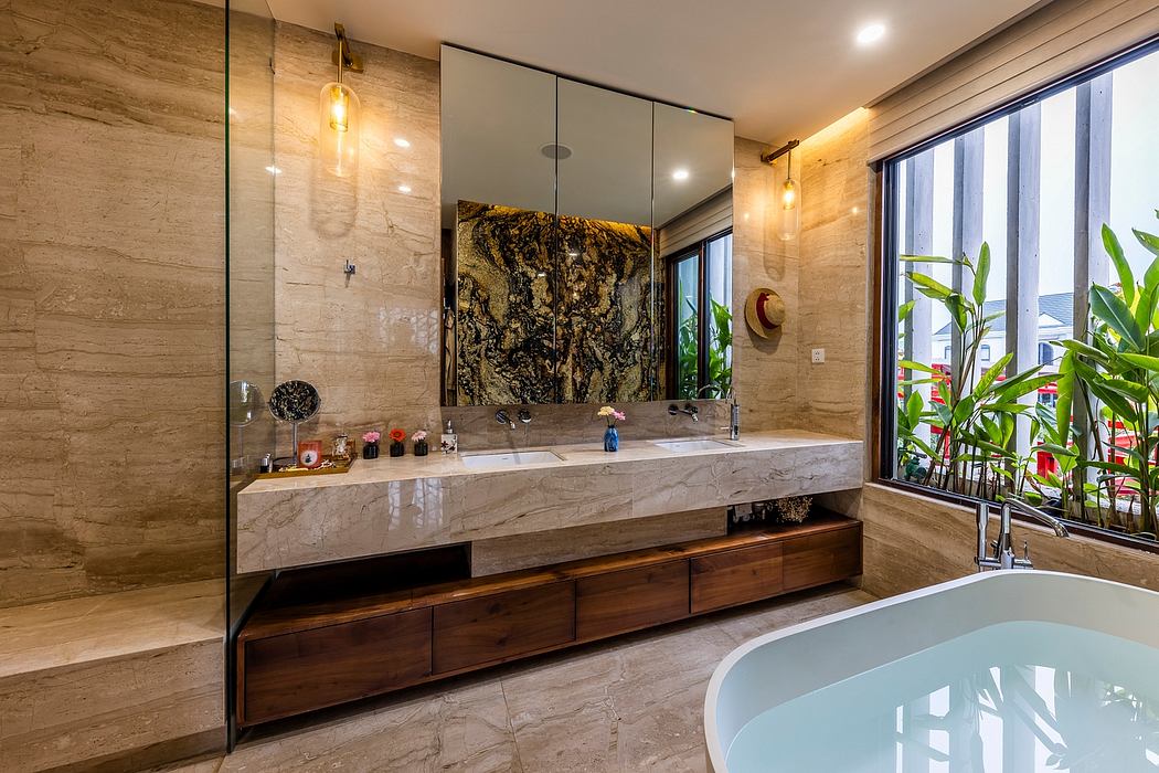 Luxurious bathroom with marble countertop, wooden vanity, and large glass wall.