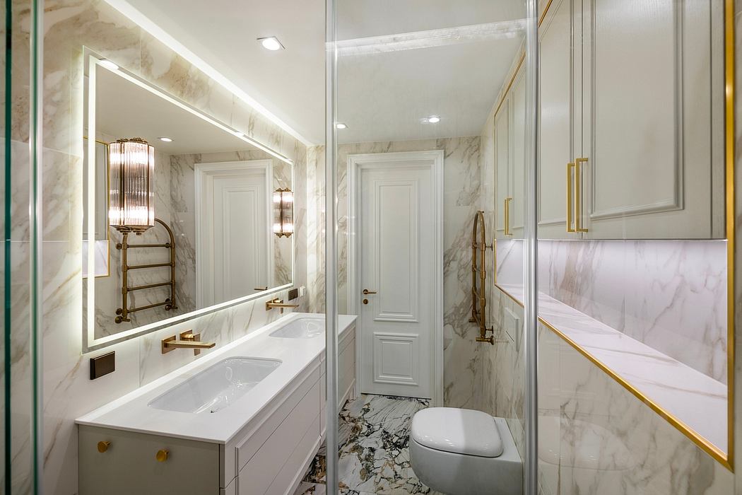 Luxurious marble bathroom with recessed lighting, gold fixtures, and minimalist design.
