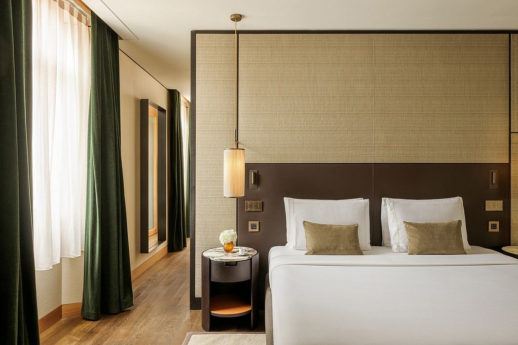 Elegant hotel room with warm lighting, textured wall panels, and modern furniture.