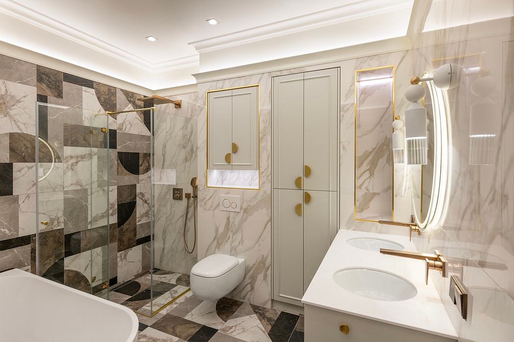 Elegant bathroom with marble tiles, gold accents, and a modern vanity and shower.