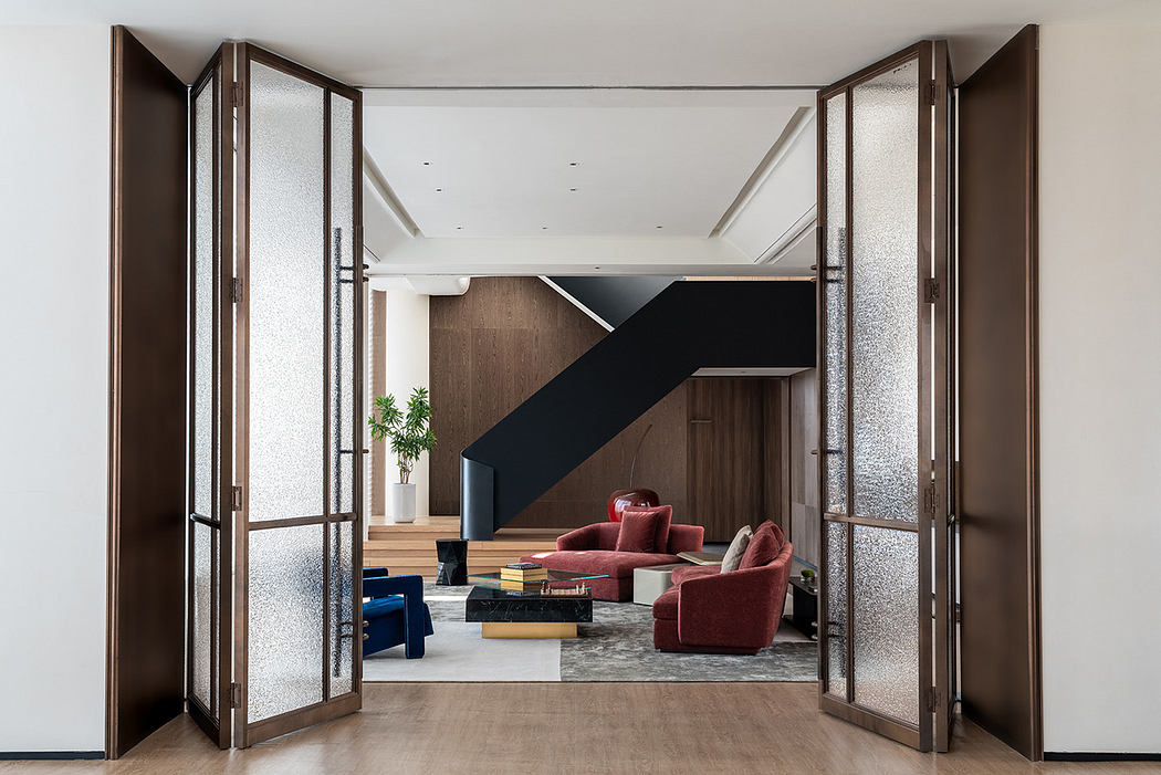 A modern and stylish interior design featuring a spacious open-plan layout, with dark accents and plush, vibrant furniture.