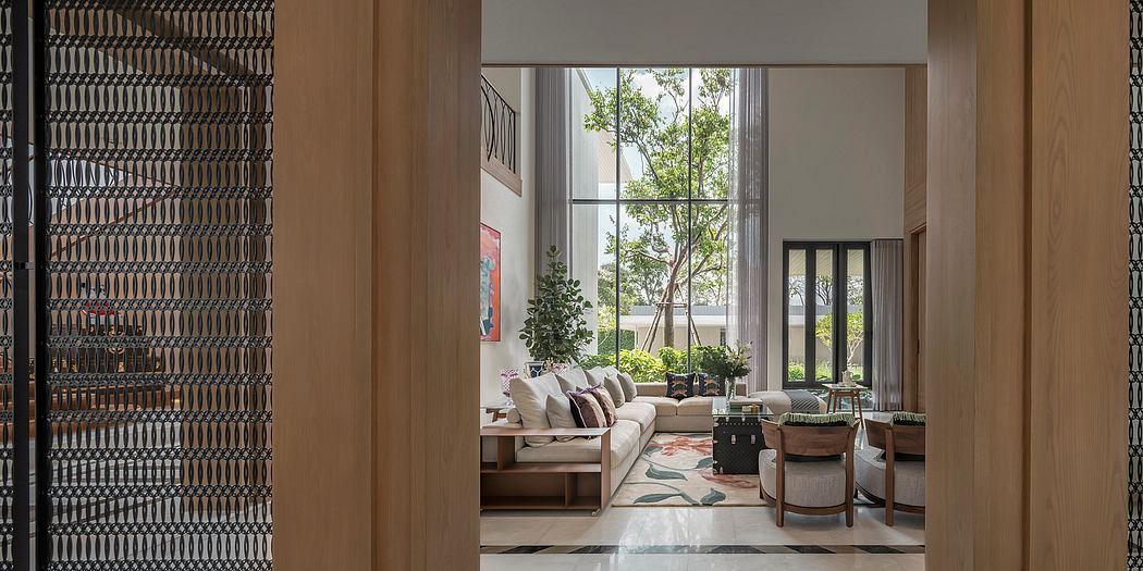 A modern living room with floor-to-ceiling windows, wood accents, and lush indoor greenery.