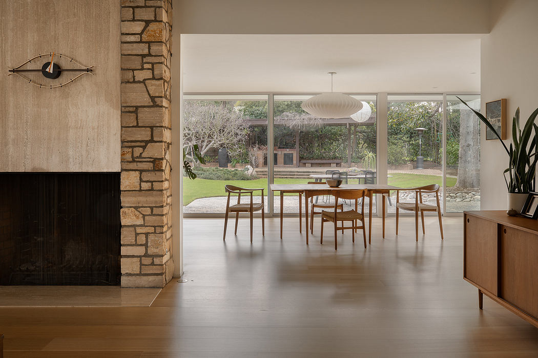 Expansive open-concept living space with mid-century modern furnishings and garden views.