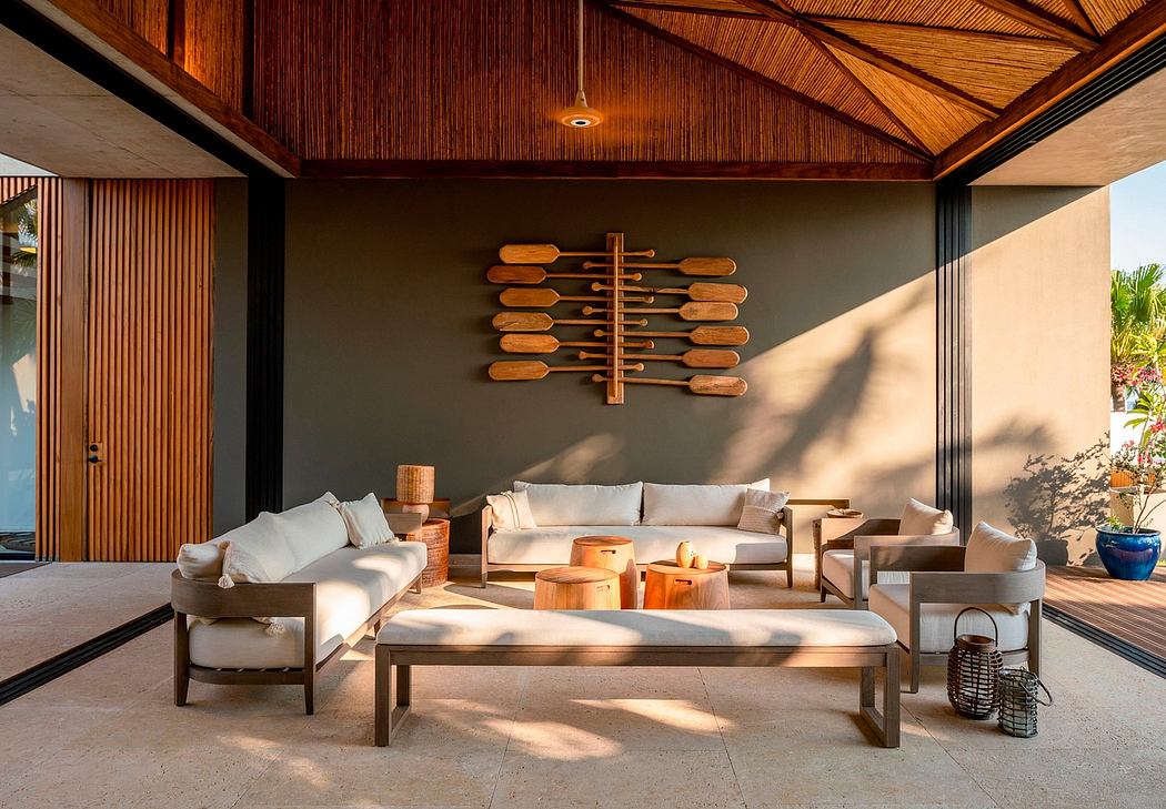 Luxurious open-concept space with wooden accents, plush seating, and striking wall decor.