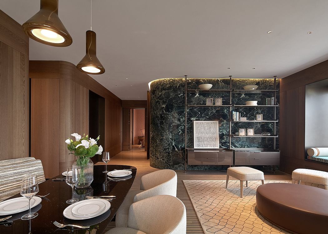 Luxurious open-plan living area with marble feature wall, modern lighting, and plush seating.