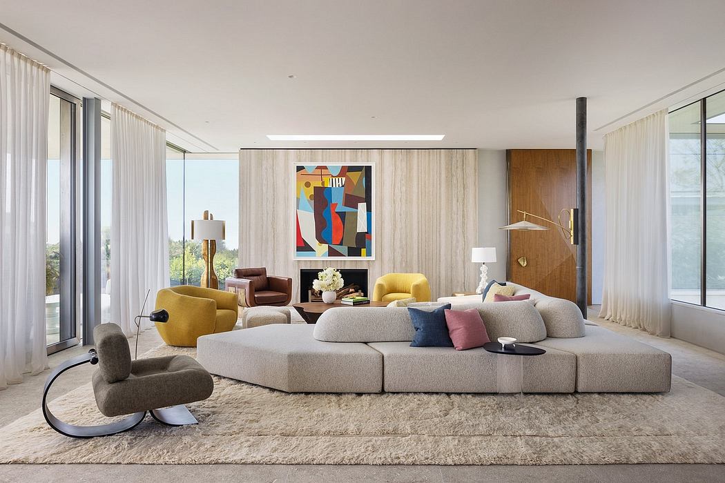 Spacious modern living room with modular sofa, vibrant artwork, and abundant natural light.