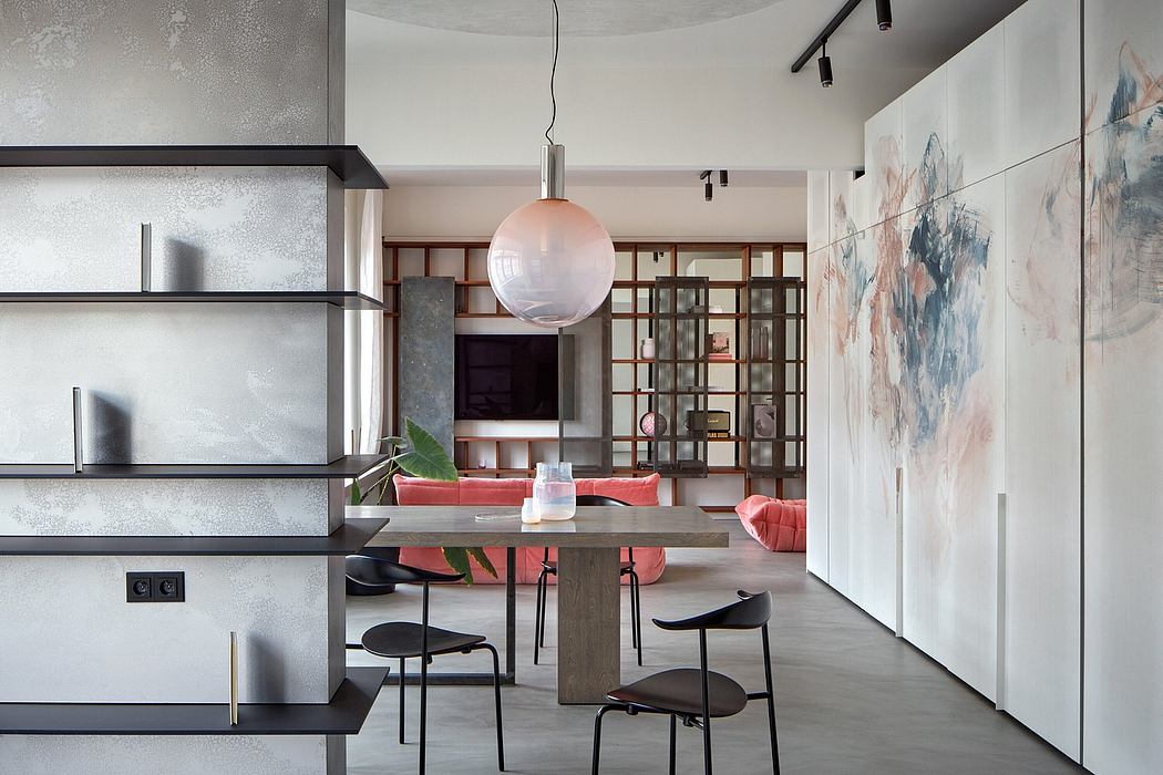 Modern living room with concrete shelving, globe pendant, and abstract artwork.