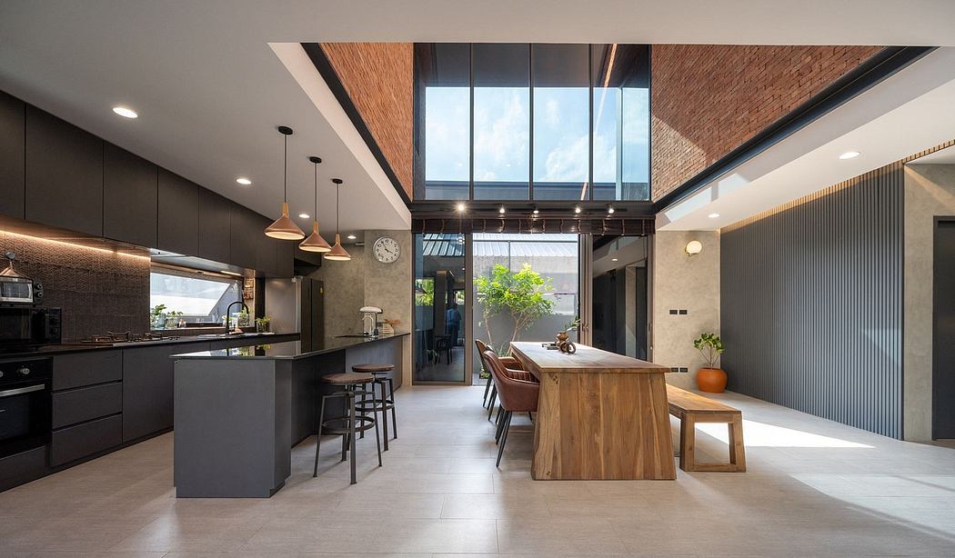 Spacious kitchen with industrial-style decor, wood accents, and large glass windows.