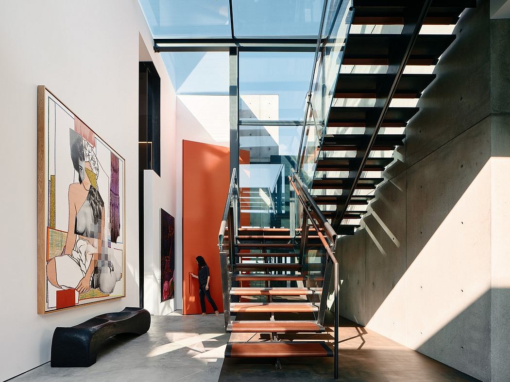 Striking modern staircase design with abstract artwork and bright accents.
