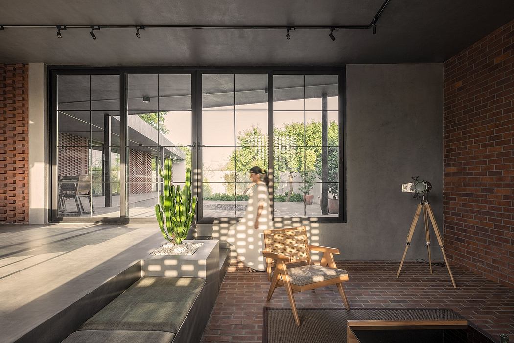 Minimalist modern interior design with brick walls, glass panels, and natural lighting.