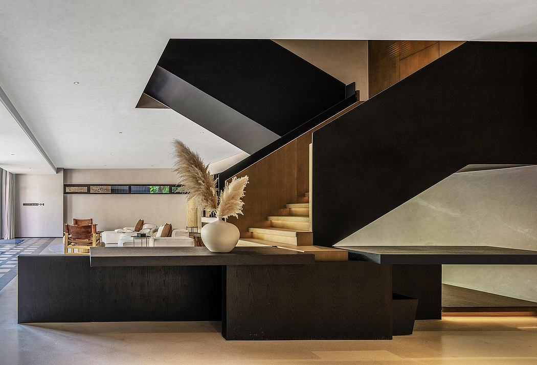 A modern, minimalist living room with geometric, angular design elements and wood accents.