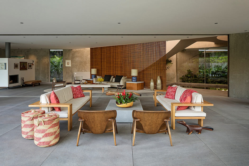 Expansive open-plan living area with warm wood accents, modern furniture, and abundant natural light.
