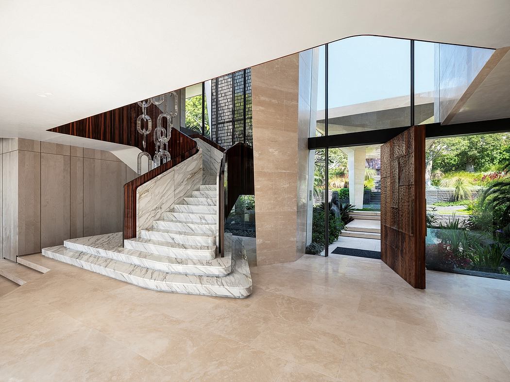 Spacious, modern entryway with elegant marble stairs, glass walls, and wood accents.