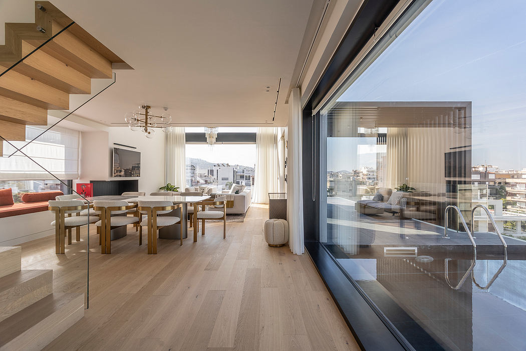 Spacious, modern apartment with wooden floors, large windows, and stylish furnishings.