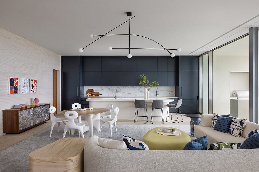 Elegant, contemporary open-plan living with minimalist lighting and modern kitchen.