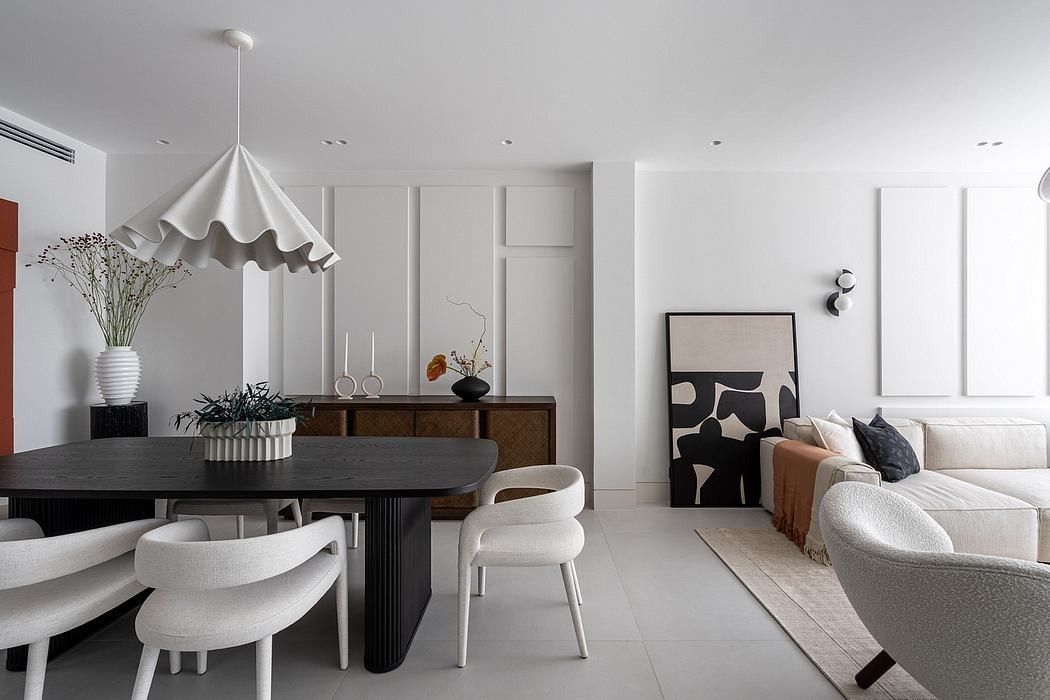 Elegant modern dining room with minimalist furniture, dramatic lighting, and abstract art.