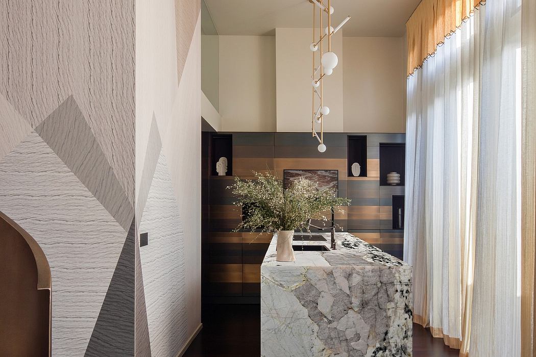 Sleek modern kitchen design with bold geometric patterns, textured walls, and marble countertop.