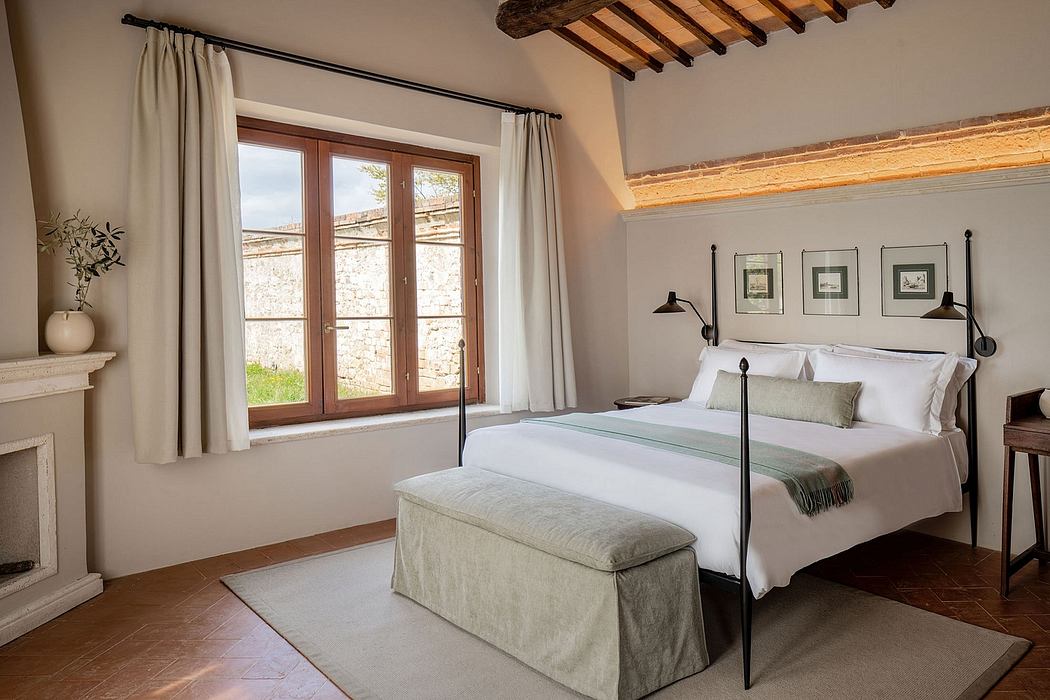 Rustic-chic bedroom with wooden beams, large window, and minimalist decor.