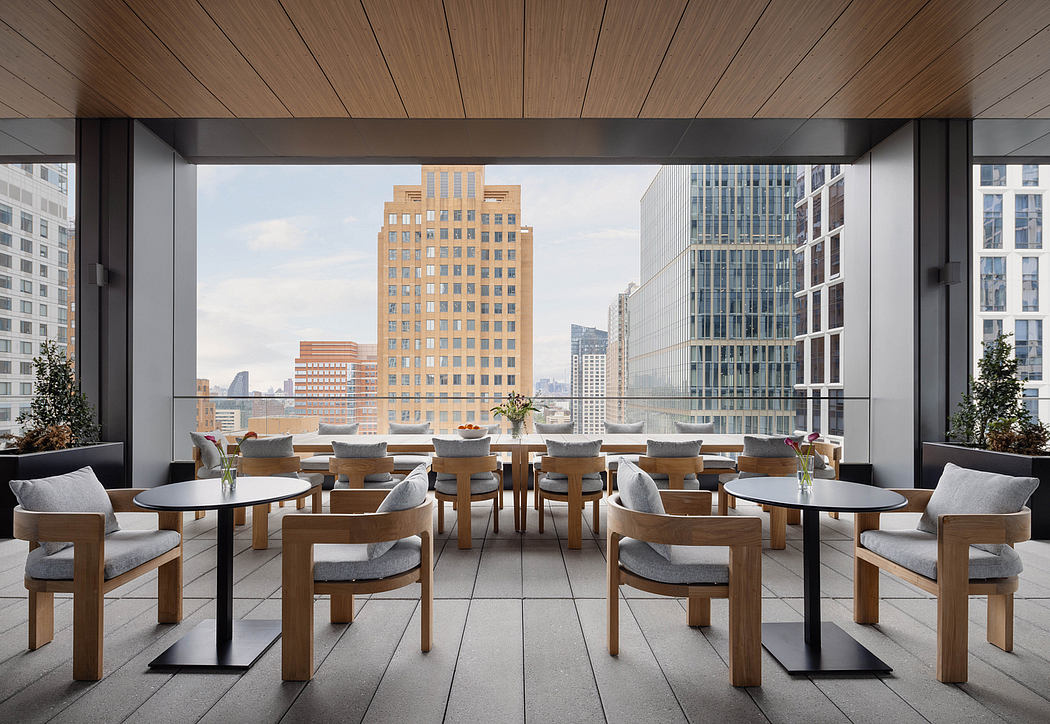 Spacious modern dining area with panoramic city views, wooden furniture and neutral tones.