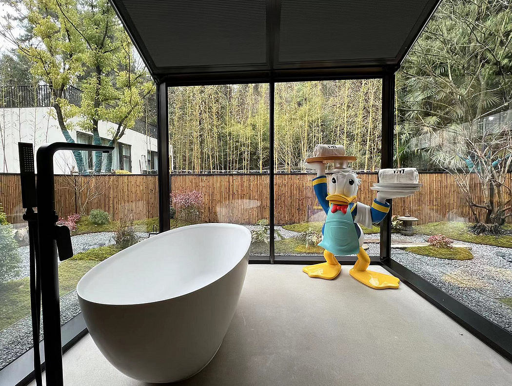 Sleek, modern bathroom interior with large glass windows overlooking lush greenery.